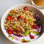 Healthy Weight Loss Breakfast: Yogurt bowl with granola, strawberries, kiwi, and blueberries