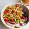 Healthy Weight Loss Breakfast: Yogurt bowl with granola, strawberries, kiwi, and blueberries